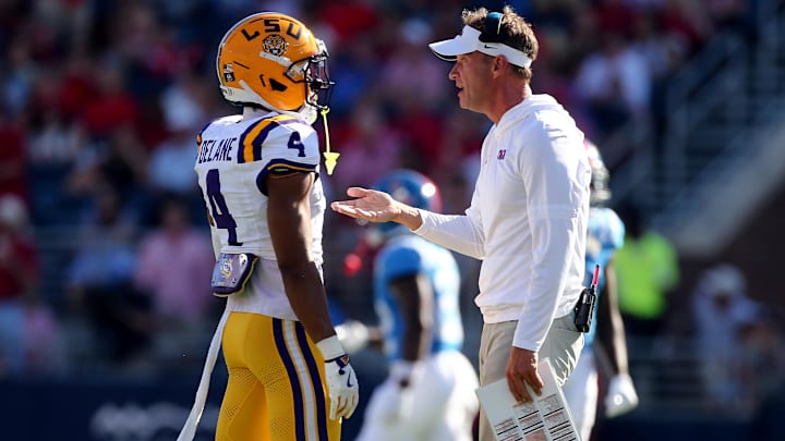 Sep 27, 2025; Oxford, Mississippi, USA; Mississippi Rebels head coach Lane Kiffin talks with LSU Tigers cornerback Mansoor Delane (4) during the second quarter at Vaught-Hemingway Stadium. Mandatory Credit: Petre Thomas-Imagn Images