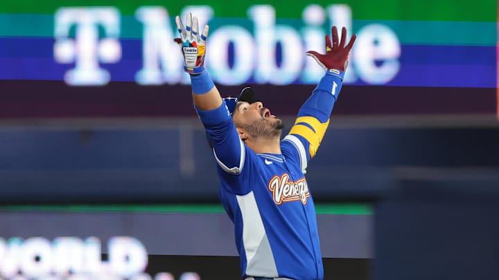 Mar 17, 2026; Miami, FL, United States; Venezuela third baseman Eugenio Suarez (7) reacts after hitting a RBI double against the United States in the ninth inning during the 2026 World Baseball Classic Championship game at loanDepot Park. Mandatory Credit: Sam Navarro-Imagn Images