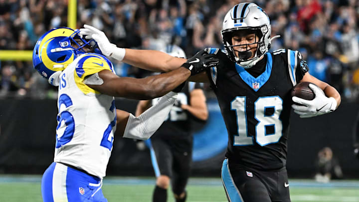 Carolina Panthers wide receiver Jalen Coker (18) makes a catch against Los Angeles Rams safety Kamren Kinchens