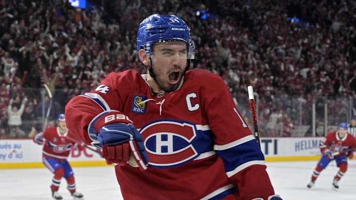 Apr 25, 2025; Montreal, Quebec, CAN; Montreal Canadiens forward Nick Suzuki (14) celebrates after scoring a goal against the Washington Capitals during the second period in game three of the first round of the 2025 Stanley Cup Playoffs at the Bell Centre. Mandatory Credit: Eric Bolte-Imagn Images