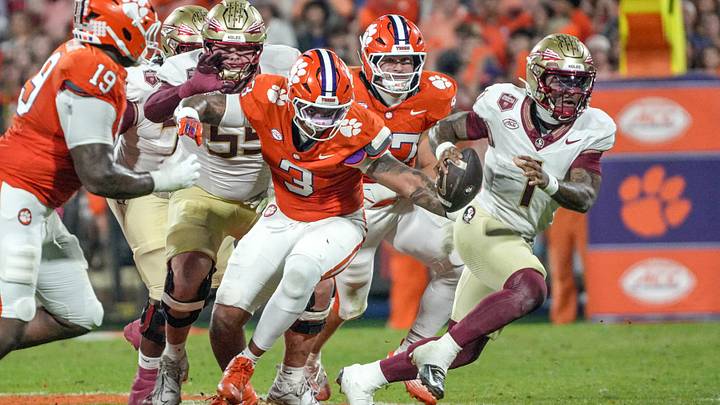 Nov 8, 2025; Clemson, South Carolina, USA; Florida State Seminoles quarterback Tommy Castellanos (1) runs near Clemson Tigers defensive end T.J. Parker (3) during the second quarter at Memorial Stadium. Mandatory Credit: Ken Ruinard - GREENVILLE NEWS-USA TODAY Network via Imagn Images Nov 8, 2025; Clemson, South Carolina, USA; Florida State Seminoles quarterback Tommy Castellanos (1) runs near Clemson Tigers defensive end T.J. Parker (3) during the second quarter at Memorial Stadium. Mandatory Credit: Ken Ruinard - GREENVILLE NEWS-USA TODAY Network via Imagn Images