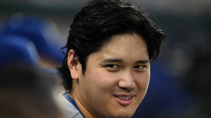 Los Angeles Dodgers designated hitter Shohei Ohtani (17) talks with the team trainer in the dugout against the Detroit Tigers in the fifth inning at Comerica Park on Aug. 28, 2026.