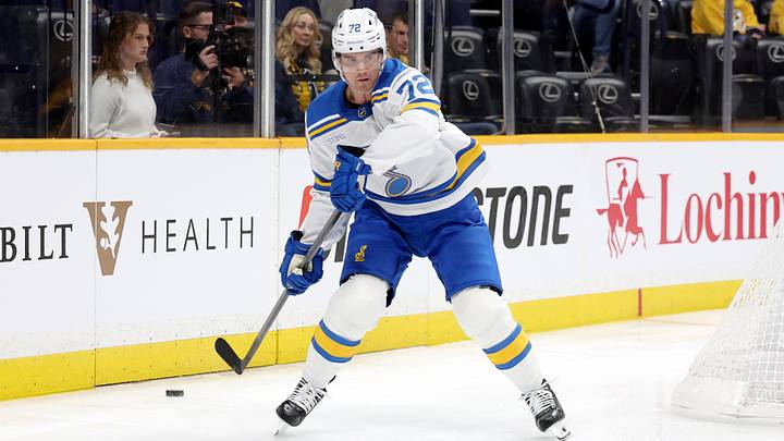 Oct 17, 2026; Nashville, Tennessee, USA;  St. Louis Blues defenseman Justin Barron (72) passes the puck during the first period against the Nashville Predators at Bridgestone Arena.  Mandatory Credit: Alan Poizner-Imagn Images