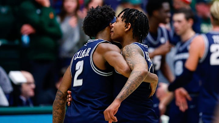 Utah State Aggies guard MJ Collins Jr. (2) and guard Elijah Perryman (1). 