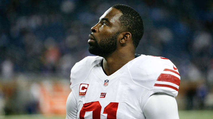 Dec 22, 2013; Detroit, MI, USA; New York Giants defensive end Justin Tuck (91) looks up before the game against the Detroit Lions at Ford Field. Giants beat the Lions 23-20. Mandatory Credit: Raj Mehta-Imagn Images