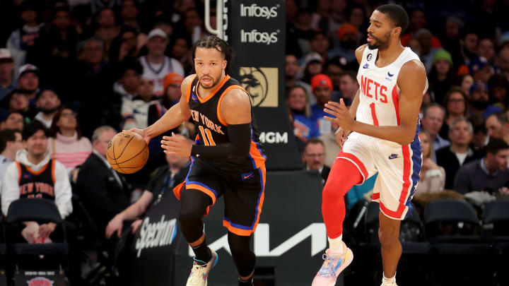 New York Knicks guard Jalen Brunson (11) brings the ball up court against Mikal Bridges. New York Knicks guard Jalen Brunson (11) brings the ball up court against Mikal Bridges.