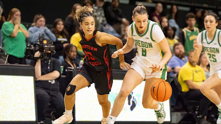 Oregon guard Elisa Mevius, right, moves the ball up the court under cover from Western Oregon guard Enid Vaifanua as the Oregon Ducks host the Western Oregon Wolves in an exhibition game at Matthew Knight Arena in Eugene on Oct. 30, 2025. Oregon guard Elisa Mevius, right, moves the ball up the court under cover from Western Oregon guard Enid Vaifanua as the Oregon Ducks host the Western Oregon Wolves in an exhibition game at Matthew Knight Arena in Eugene on Oct. 30, 2025.