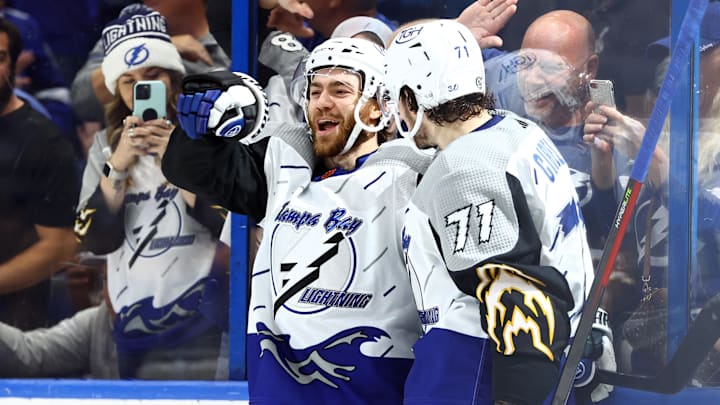Dec 8, 2022; Tampa, Florida, USA; Tampa Bay Lightning center Brayden Point (21) is congratulated by center Anthony Cirelli (71) after he scores a goal against the Nashville Predators during the third period at Amalie Arena. Mandatory Credit: Kim Klement-Imagn Images