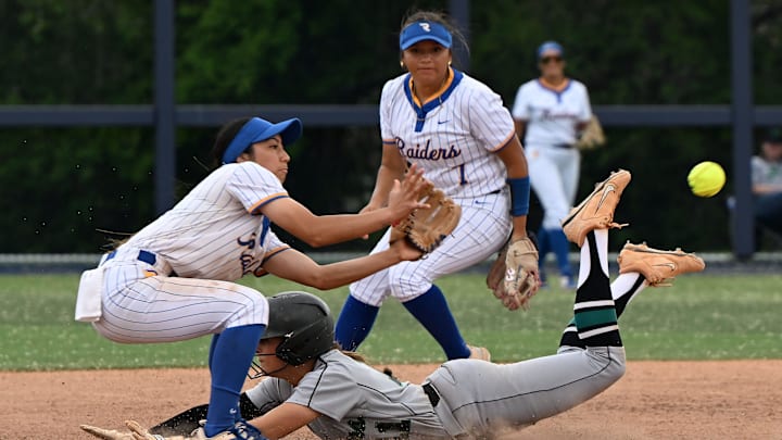 Reed's Kehaulani Tambaoan waits for the ball as Palo Verde's Taylor slides into second base during the NIAA state softball game at Christina M. Hixson Softball Park on Thursday, May 15, 2025. 