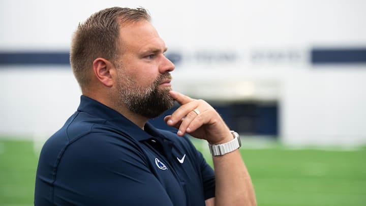 Penn State offensive coordinator Andy Kotelnicki listens to a question from a reporter during an interview in Holuba Hall. 