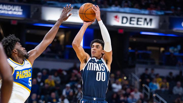 Feb 22, 2026; Indianapolis, Indiana, USA;  Dallas Mavericks guard Max Christie (00) shoots the ball while  Indiana Pacers forward Jarace Walker (5) defends in the second half at Gainbridge Fieldhouse. Mandatory Credit: Trevor Ruszkowski-Imagn Images