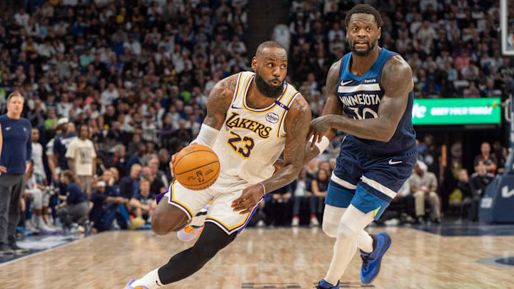 Apr 27, 2025; Minneapolis, Minnesota, USA; Los Angeles Lakers forward LeBron James (23) dribbles past Minnesota Timberwolves forward Julius Randle (30) in the second quarter during game four of first round for the 2025 NBA Playoffs at Target Center. Mandatory Credit: Matt Blewett-Imagn Images Apr 27, 2025; Minneapolis, Minnesota, USA; Los Angeles Lakers forward LeBron James (23) dribbles past Minnesota Timberwolves forward Julius Randle (30) in the second quarter during game four of first round for the 2025 NBA Playoffs at Target Center. Mandatory Credit: Matt Blewett-Imagn Images