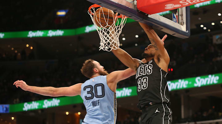 Dec 13, 2024; Memphis, Tennessee, USA; Brooklyn Nets center Nic Claxton (33) dunks over Memphis Grizzlies center Jay Huff (30) during the second quarter at FedExForum. Mandatory Credit: Petre Thomas-Imagn Images Dec 13, 2024; Memphis, Tennessee, USA; Brooklyn Nets center Nic Claxton (33) dunks over Memphis Grizzlies center Jay Huff (30) during the second quarter at FedExForum. Mandatory Credit: Petre Thomas-Imagn Images
