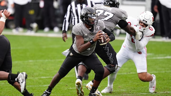 Nov 16, 2024; Boulder, Colorado, USA; Colorado Buffaloes quarterback Shedeur Sanders (2) carries the ball in the second half against the Utah Utes at Folsom Field. Mandatory Credit: Ron Chenoy-Imagn Images