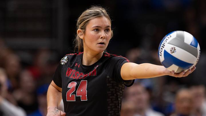 Dec 18, 2025; Kansas City, MO, USA; Wisconsin Badgers setter Charlie Fuerbringer (24) prepares to serve the ball  in a 2025 NCAA Women’s Volleyball Championship semifinal match at T-Mobile Center. Mandatory Credit: Kylie Graham-Imagn Images