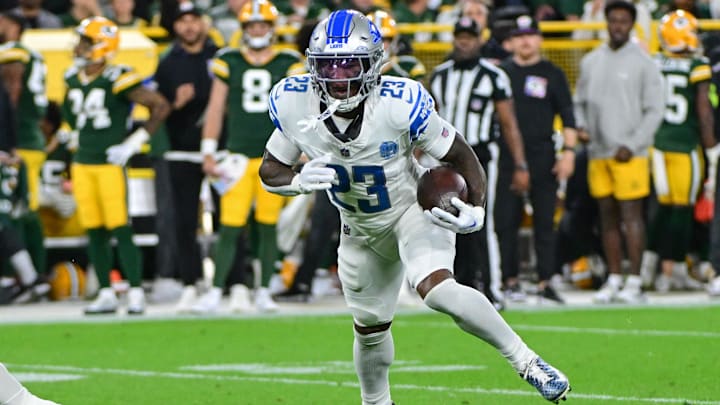 Sep 28, 2023; Green Bay, Wisconsin, USA;  Detroit Lions defensive back Jerry Jacobs (23) returns an interception in the second quarter against the Green Bay Packers at Lambeau Field.
