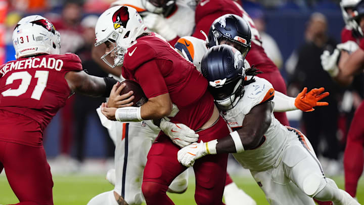 Aug 16, 2025; Denver, Colorado, USA; Denver Broncos linebacker Jordan Turner (55) sacks Arizona Cardinals quarterback Clayton Tune (15) in the second half at Empower Field at Mile High. 