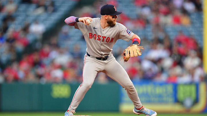Jun 23, 2025; Anaheim, California, USA; Boston Red Sox shortstop Trevor Story (10) throws to first against the Los Angeles Angels during the fourth inning at Angel Stadium. Mandatory Credit: Gary A. Vasquez-Imagn Images
