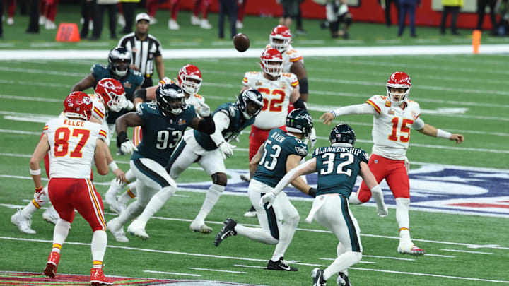 Feb 9, 2025; New Orleans, LA, USA;  Kansas City Chiefs quarterback Patrick Mahomes (15) completes a pass to Kansas City Chiefs tight end Travis Kelce (87) against the Philadelphia Eagles in the third quarter in Super Bowl LIX at Ceasars Superdome. Mandatory Credit: Stephen Lew-Imagn Images