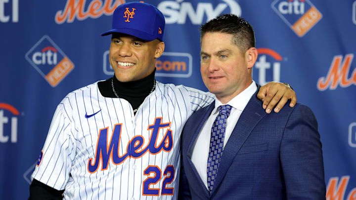Dec 12, 2024; Flushing, NY, USA; New York Mets right fielder Juan Soto poses for photos with manager Carlos Mendoza during a press conference at Citi Field. Mandatory Credit: Brad Penner-Imagn Images