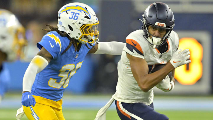 Dec 19, 2024; Inglewood, California, USA; Denver Broncos wide receiver Devaughn Vele (17) is stopped by Los Angeles Chargers cornerback Ja'Sir Taylor (36) after a complete pass in the first half at SoFi Stadium. Mandatory Credit: Jayne Kamin-Oncea-Imagn Images Dec 19, 2024; Inglewood, California, USA; Denver Broncos wide receiver Devaughn Vele (17) is stopped by Los Angeles Chargers cornerback Ja'Sir Taylor (36) after a complete pass in the first half at SoFi Stadium. Mandatory Credit: Jayne Kamin-Oncea-Imagn Images