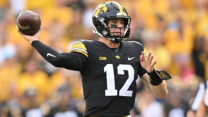 Sep 16, 2023; Iowa City, Iowa, USA; Iowa Hawkeyes quarterback Cade McNamara (12) throws a pass against the Western Michigan Broncos during the fourth quarter at Kinnick Stadium. Mandatory Credit: Jeffrey Becker-USA TODAY Sports