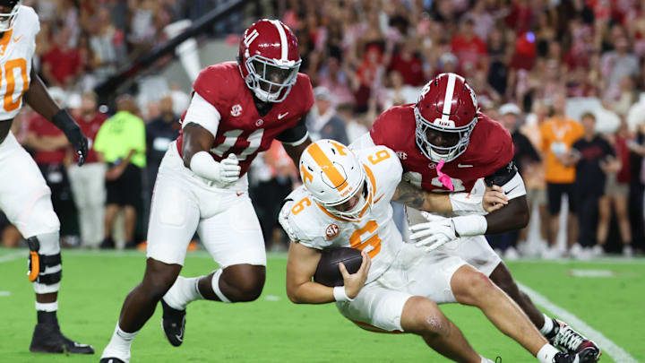 Oct 18, 2025; Tuscaloosa, Alabama, USA; Tennessee Volunteers quarterback Joey Aguilar (6) is sacked by Alabama Crimson Tide linebacker Yhonzae Pierre (42) during the first quarter at Saban Field at Bryant-Denny Stadium. Mandatory Credit: David Leong-Imagn Images