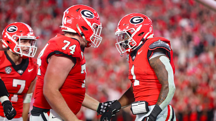 Oct 12, 2024; Athens, Georgia, USA; Georgia Bulldogs running back Trevor Etienne (1) celebrates after a touchdown with offensive lineman Drew Bobo (74) against the Mississippi State Bulldogs in the fourth quarter at Sanford Stadium. Mandatory Credit: Brett Davis-Imagn Images
