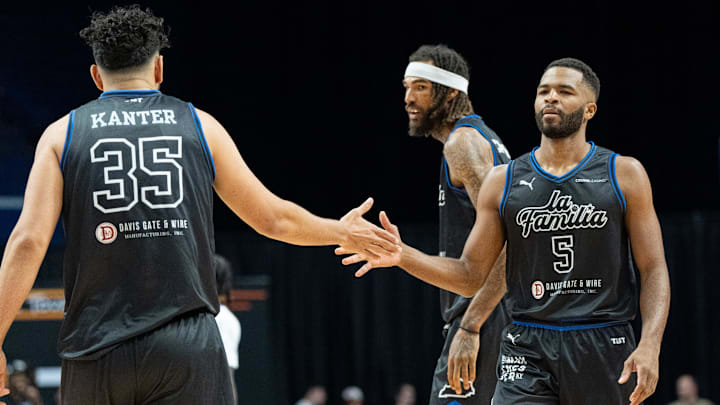 La Familia's Kerem Kanter (35) celebrates a play with Andrew Harrison (5) during their game against the 305 Ballers on Friday, July 19, 2024 in Lexington, Ky. at Rupp Arena during the first round of The Basketball Tournament.