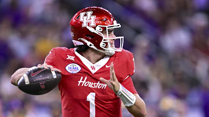Dec 27, 2025; Houston, TX, USA; Houston Cougars quarterback Conner Weigman (1) looks to pass the ball during the first half against the Louisiana State Tigers at NRG Stadium. Mandatory Credit: Maria Lysaker-Imagn Images 