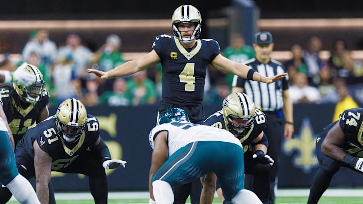 Sep 22, 2024; New Orleans, Louisiana, USA; New Orleans Saints quarterback Derek Carr (4) calls a play at the line against the Philadelphia Eagles during the second half at Caesars Superdome. Mandatory Credit: Stephen Lew-Imagn Images