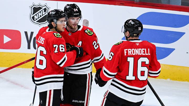 Sep 21, 2026; Chicago, Illinois, USA;  Chicago Blackhawks defenseman Bowen Byram (24) celebrates with  left wing Nick Lardis (76)  and  center Anton Frondell (16) after he scored the game winning goal during the overtime period against the Minnesota Wild  at the United Center.  Mandatory Credit: Matt Marton-Imagn Images