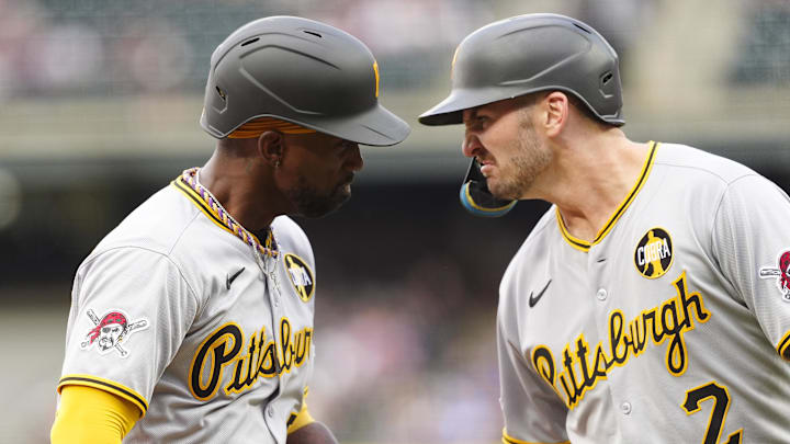 Aug 1, 2025; Denver, Colorado, USA; Pittsburgh Pirates designated hitter Andrew McCutchen (22) celebrates his three run home run with first baseman Spencer Horwitz (2) in the first inning against the Colorado Rockies at Coors Field. Mandatory Credit: Ron Chenoy-Imagn Images