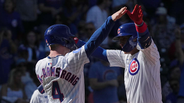Feb 21, 2025; Mesa, Arizona, USA; Chicago Cubs catcher Miguel Amaya (9) celebrates with Pete Crow-Armstrong (4) after hitting a two run home run against the Los Angeles Dodgers during the third inning at Sloan Park.