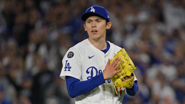 Oct 1, 2025; Los Angeles, California, USA; Los Angeles Dodgers pitcher Roki Sasaki (11) reacts to the final out against the Cincinnati Reds during game two of the Wildcard round for the 2025 MLB playoffs at Dodger Stadium. Mandatory Credit: Jayne Kamin-Oncea-Imagn Images Oct 1, 2025; Los Angeles, California, USA; Los Angeles Dodgers pitcher Roki Sasaki (11) reacts to the final out against the Cincinnati Reds during game two of the Wildcard round for the 2025 MLB playoffs at Dodger Stadium. Mandatory Credit: Jayne Kamin-Oncea-Imagn Images