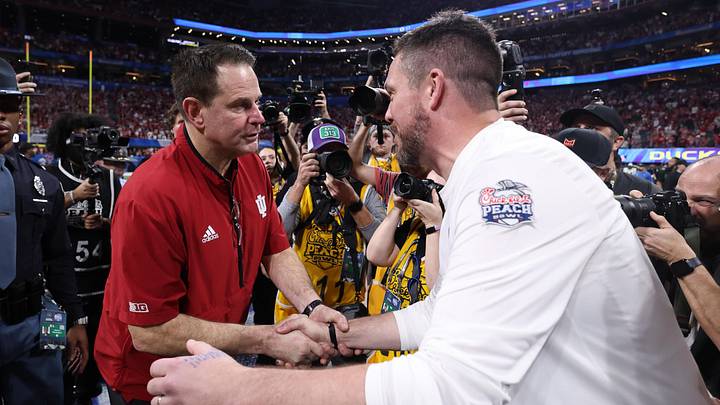 Jan 9, 2026; Atlanta, GA, USA; Indiana Hoosiers head coach Curt Cignetti and Oregon Ducks head coach Dan Lanning shake hands after the 2025 Peach Bowl and semifinal game of the College Football Playoff at Mercedes-Benz Stadium. Mandatory Credit: Brett Davis-Imagn Images