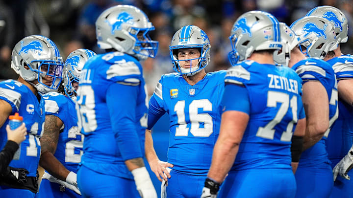 Detroit Lions quarterback Jared Goff (16), center, talks to teammates before a play against Green Bay Packers during the first half at Ford Field in Detroit on Thursday, Dec. 5, 2024.