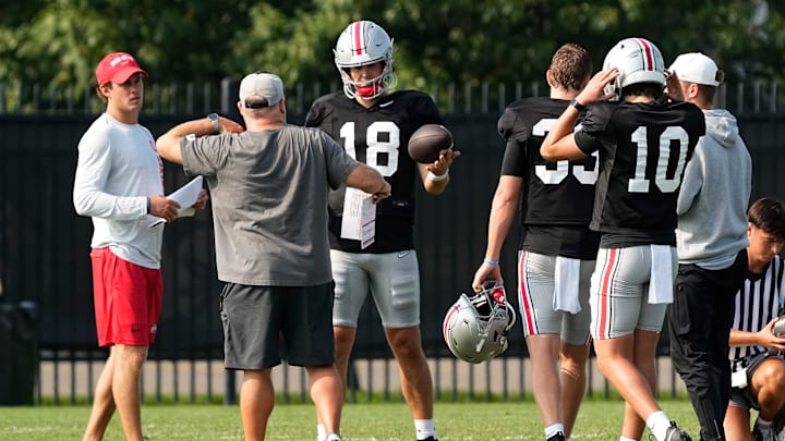 Aug 8, 2024; Columbus, Ohio, USA; Ohio State Buckeyes offensive coordinator Chip Kelly works with quarterback Will Howard (18) during football practice at the Woody Hayes Athletic Complex.