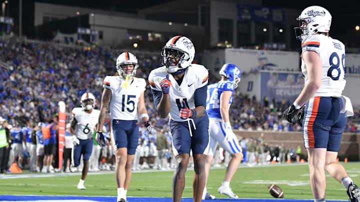Nov 15, 2025; Durham, North Carolina, USA;  Virginia Cavaliers wide receiver Trell Harris (11) celebrates a touchdown against the Duke Blue Devils in the third quarter at Wallace Wade Stadium. Mandatory Credit: Zachary Taft-Imagn Images