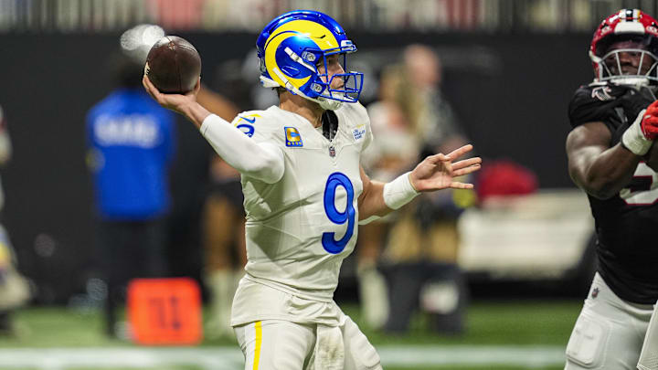 Dec 29, 2025; Atlanta, Georgia, USA; Los Angeles Rams quarterback Matthew Stafford (9) throws an interception to Atlanta Falcons safety Jessie Bates III (3) (not shown) during the first half at Mercedes-Benz Stadium. Mandatory Credit: Dale Zanine-Imagn Images