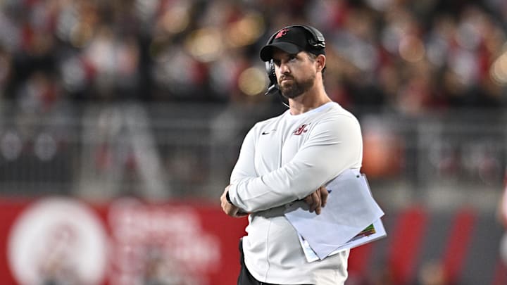 Aug 30, 2025; Pullman, Washington, USA; Washington State Cougars head coach Jimmy Rogers watches a replay on the video board during a game against the Idaho Vandals in the second half at Gesa Field at Martin Stadium. Washington State Cougars won 13-10. Mandatory Credit: James Snook-Imagn Images Aug 30, 2025; Pullman, Washington, USA; Washington State Cougars head coach Jimmy Rogers watches a replay on the video board during a game against the Idaho Vandals in the second half at Gesa Field at Martin Stadium. Washington State Cougars won 13-10. Mandatory Credit: James Snook-Imagn Images