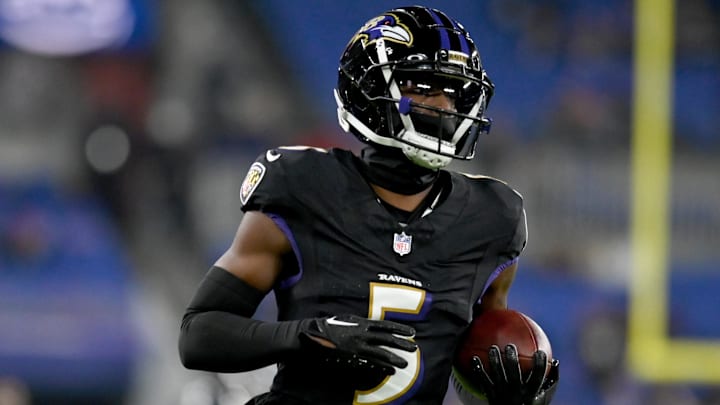 Nov 16, 2023; Baltimore, Maryland, USA; Baltimore Ravens cornerback Jalyn Armour-Davis (5) warms up before a game against the Cincinnati Bengals at M&T Bank Stadium. Mandatory Credit: Tommy Gilligan-Imagn Images