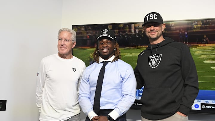 Apr 25, 2025; Henderson, NV, USA; (L-R) Las Vegas Raiders head coach Pete Carroll, Ashton Jeanty and general manager John Spytek pose after a news conference introducing Jeanty as the first round draft pick in the 2025 NFL Draft at Intermountain Health Performance Center. Mandatory Credit: Candice Ward-Imagn Images