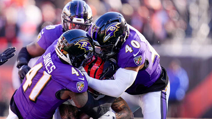 Cincinnati Bengals running back Chase Brown (30) is wrapped up on a carry in the first quarter of the NFL Week 15 game between the Cincinnati Bengals and the Baltimore Ravens at Paycor Stadium in Cincinnati on Sunday, Dec. 14, 2025. Cincinnati Bengals running back Chase Brown (30) is wrapped up on a carry in the first quarter of the NFL Week 15 game between the Cincinnati Bengals and the Baltimore Ravens at Paycor Stadium in Cincinnati on Sunday, Dec. 14, 2025.