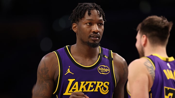 Mar 31, 2025; Los Angeles, California, USA;  Los Angeles Lakers forward Dorian Finney-Smith (17) reacts to a play during the fourth quarter against the Houston Rockets at Crypto.com Arena. Mandatory Credit: Kiyoshi Mio-Imagn Images