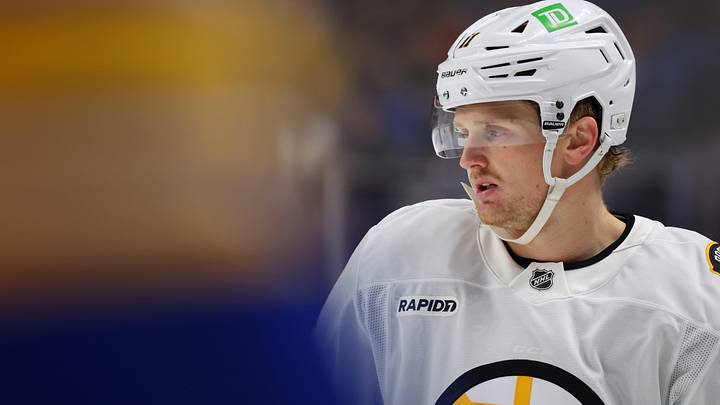 Mar 25, 2026; Buffalo, New York, USA;  Boston Bruins center Casey Mittelstadt (11) waits for the face-off during the first period against the Buffalo Sabres at KeyBank Center. Mandatory Credit: Timothy T. Ludwig-Imagn Images
