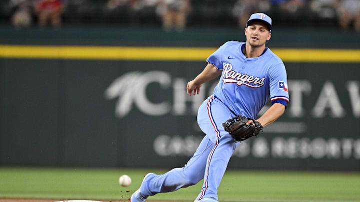 Aug 24, 2025; Arlington, Texas, USA; Texas Rangers shortstop Corey Seager (5) cannot field a ball hit by Cleveland Guardians second baseman Brayan Rocchio (not pictured) during the second inning at Globe Life Field. Mandatory Credit: Jerome Miron-Imagn Images Aug 24, 2025; Arlington, Texas, USA; Texas Rangers shortstop Corey Seager (5) cannot field a ball hit by Cleveland Guardians second baseman Brayan Rocchio (not pictured) during the second inning at Globe Life Field. Mandatory Credit: Jerome Miron-Imagn Images