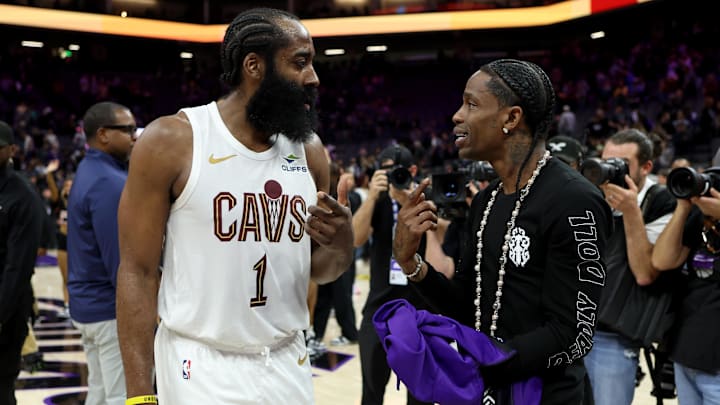 Feb 7, 2026; Sacramento, California, USA; Cleveland Cavaliers guard James Harden (1) talks with rapper Travis Scott after a game against the Sacramento Kings at Golden 1 Center. Mandatory Credit: Dennis Lee-Imagn Images