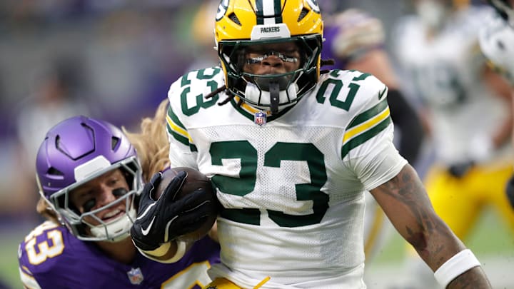 Green Bay Packers running back Emanuel Wilson (23) loses 18-yards on a run against the Minnesota Vikings during their football game Sunday, January 4, 2026, at U.S. Bank Stadium in Minneapolis, Minnesota.