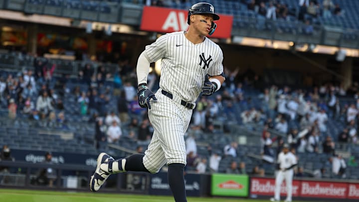 Apr 27, 2025; Bronx, New York, USA;  New York Yankees right fielder Aaron Judge (99) hits a solo home run during the sixth inning against the Toronto Blue Jays at Yankee Stadium.